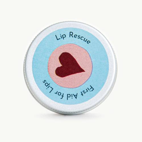 Photo shows small tin of lip rescue balm with a heart on the label 